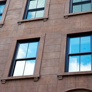 Window cleaning makes steel windows shine in a New York City building.