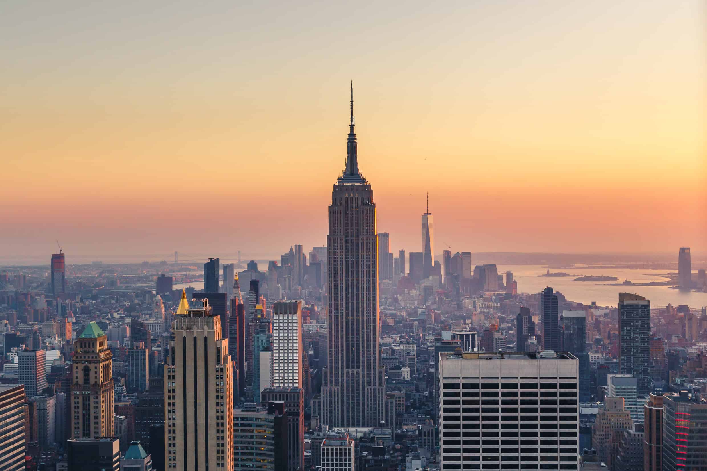 WindowFix - The New York City skyline at sunset, featuring the Empire State Building in the center and skyscrapers in the background, captures the vibrant essence of New York.